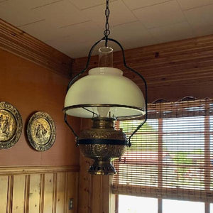 Opal glass shade on antique store lamp